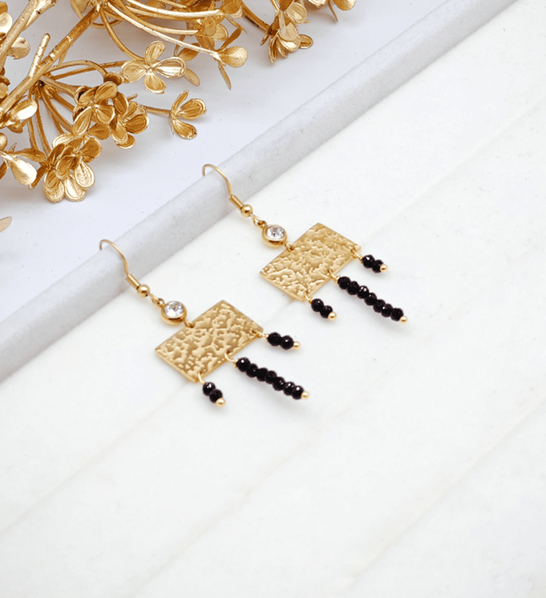 pendientes-storm-joyitas-de-acero-dorado-y-negro